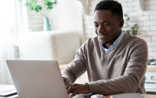 Black man working on laptop